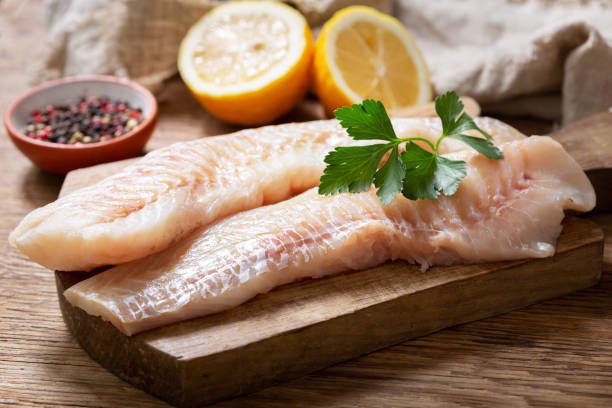 istock fresh fish fillet of cod with ingredients for cooking 1308379090
