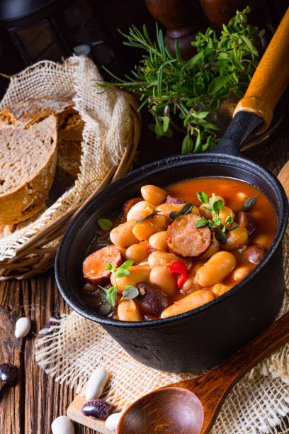 istock Delicious bean stew with sausage and potato 1308381122