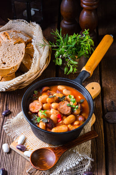 istock Delicious bean stew with sausage and potato 1308381455