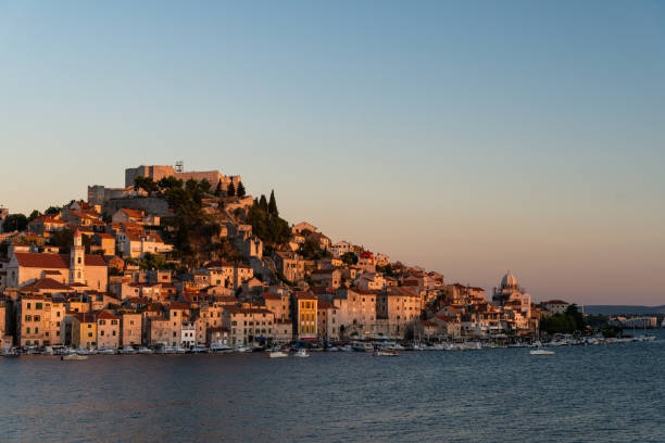 istock Sunset over old town Sibenik in Croatia 1308382175