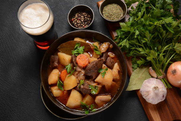 istock Irish stew made with beef, potatoes, carrots and herbs. Traditional St.Patrick's day dish, stewed in dark Guinness beer 1308383021