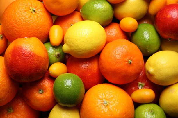 istock Different ripe citrus fruits as background, closeup 1308384318