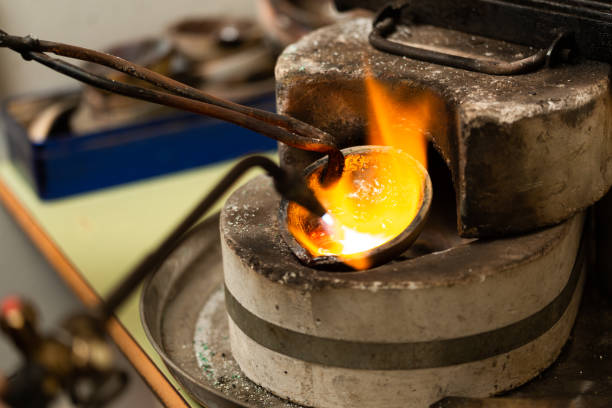 istock blowtorch melts silver in a jewelry workshop furnace 1308385587