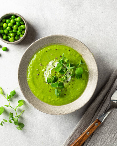 istock green pea soup, top view 1308386086