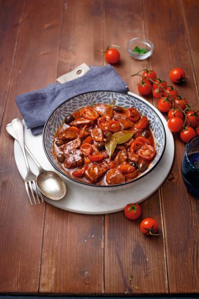 istock Chicken nuggets with tomatoes and olives 1308387633