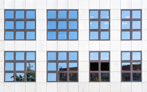 istock Low Angle View Of Glass Building Against Sky 1308387757