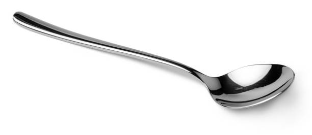 istock Silver spoon isolated on white background close up 1308387878