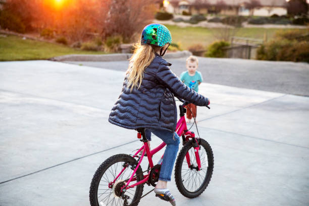 istock Girl riding Bicycle 1308388145