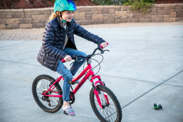 istock Girl riding Bicycle 1308388431