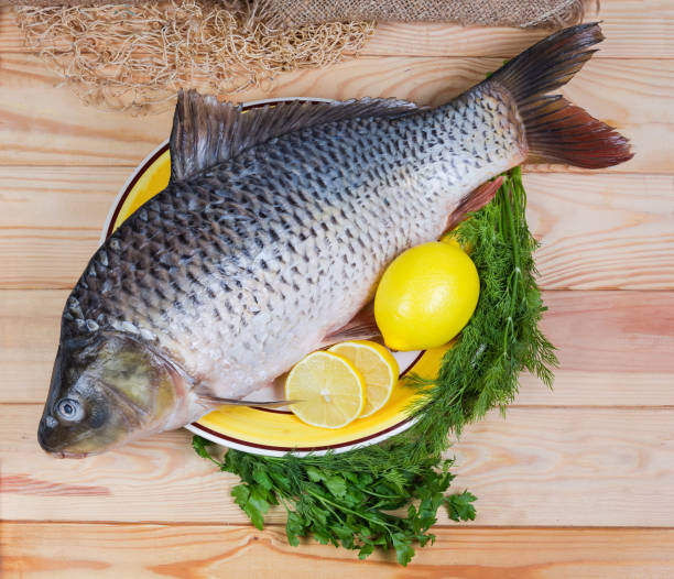 istock Raw carp prepared for cooking on dish, top view 1308391106