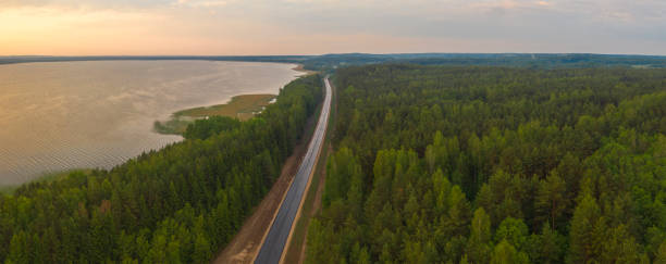 istock road along the lake 1308391542