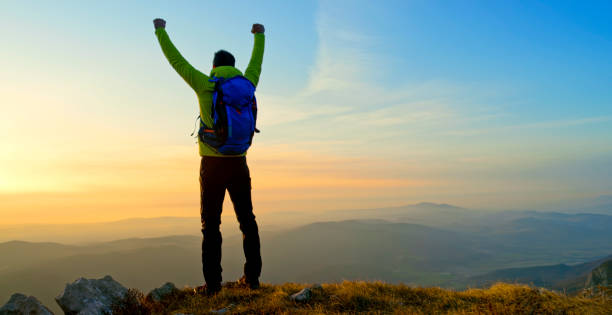 istock Mature man standing on mountain 1308391732