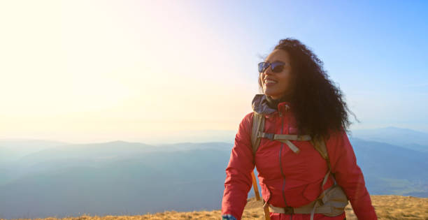 istock Mature woman walking on mountain trail 1308392038