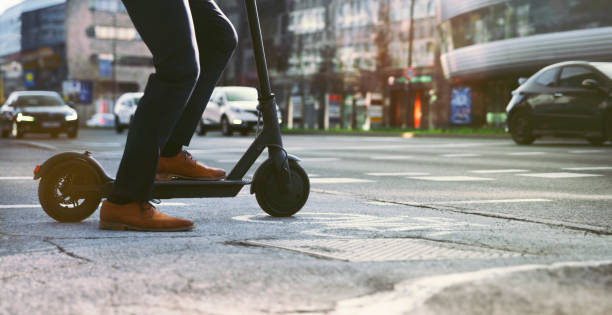 istock Businessman riding electric push scooter 1308392664