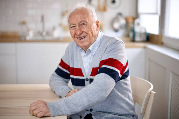 istock Smiling senior at home 1308394179