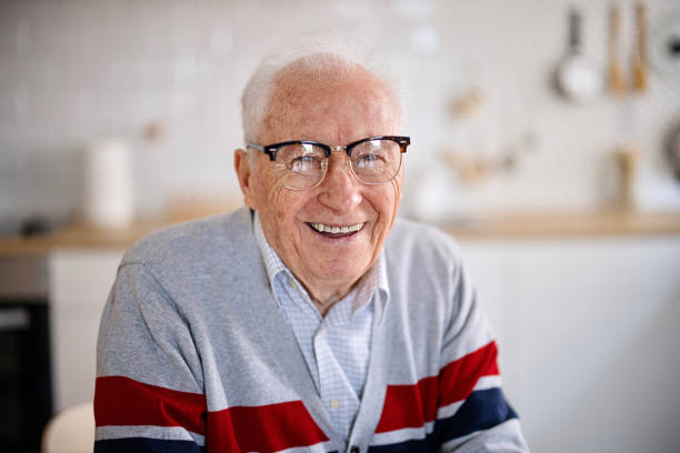istock Smiling senior at home 1308394352