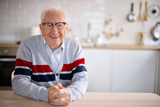Smiling senior at home Portrait of happy smiling senior at home 80 89 years stock pictures, royalty-free photos & images