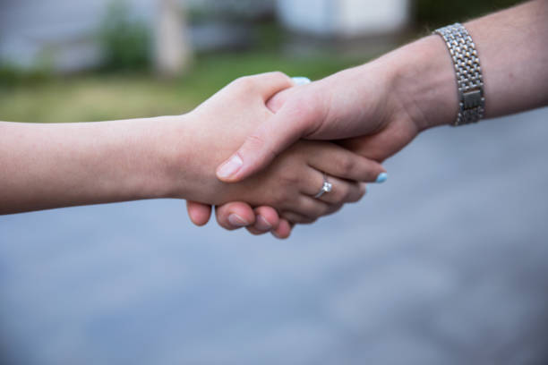 istock man and woman hand in hand 1308396500
