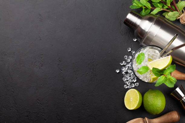 istock Mojito cocktail making. Ingredients and drink utensils 1308398130