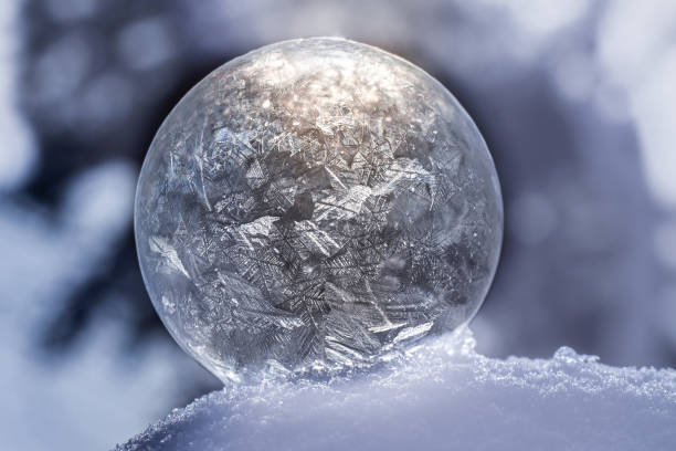 istock Close up frozen soap bubble with bokeh 1308399200