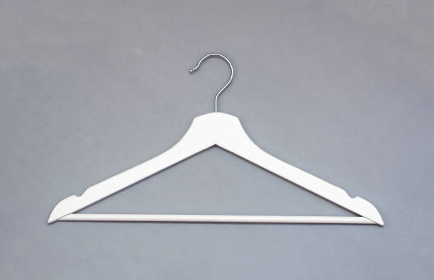 istock Creative top view flat lay white wooden hangers pastel grey background with copy space minimalism style. Template fashion social media sale store promo design feminine blog shopping concept 1308399778