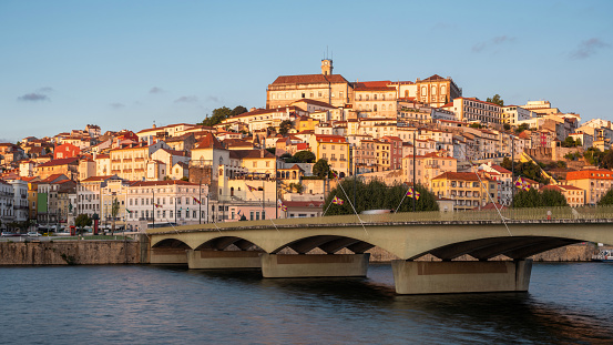Panoramic view of Coimbra cityscape and Mondego River in Portugal.