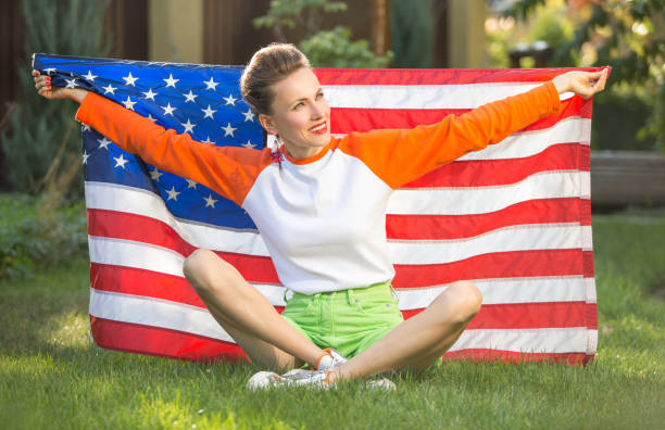 istock Woman with american flag 1308400760