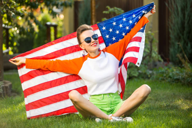 istock Woman with american flag 1308400768