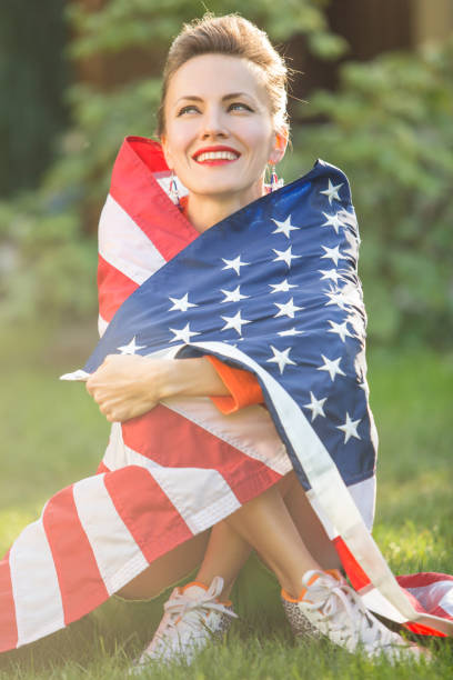 istock Woman with american flag 1308400769