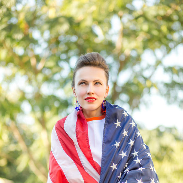 istock Woman with american flag 1308400787