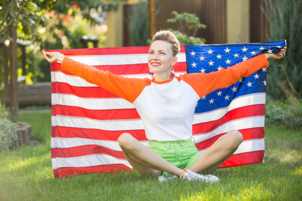 istock Woman with american flag 1308400815