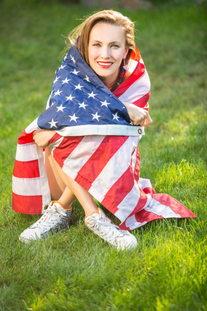 istock Woman with american flag 1308400833
