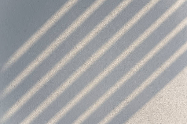 istock Abstract shadow lines from the curtain on the white wall. Background, wall art, design presentation 1308402426