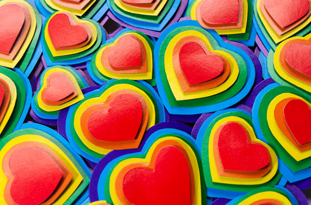 istock Lgbt Valentine's day background - rainbow hearts pattern, top view, closeup. 1308402619