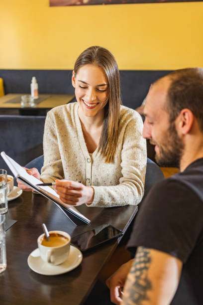 istock Young students in a coffee bar 1308402757