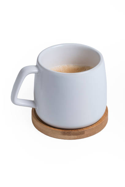 istock white cup with coffee on a wooden stand. Isolated. 1308403534