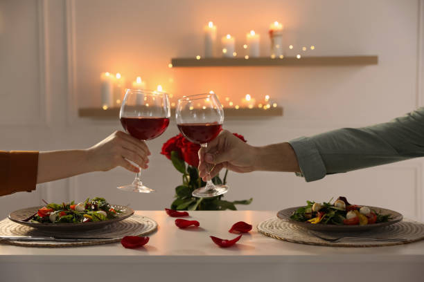 istock Couple having romantic dinner at home, closeup 1308408068