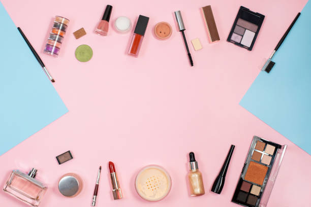 istock Set of decorative cosmetics on color background. Makeup cosmetics tools background 1308411711