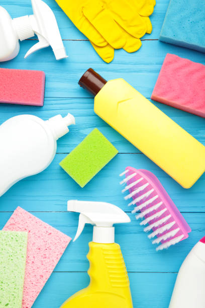 istock Set of cleaning tools on a blue background with copy space. Vertical foto 1308412196