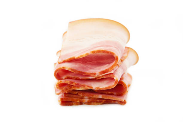 istock Bacon slices isolated on white background. Top view 1308412544