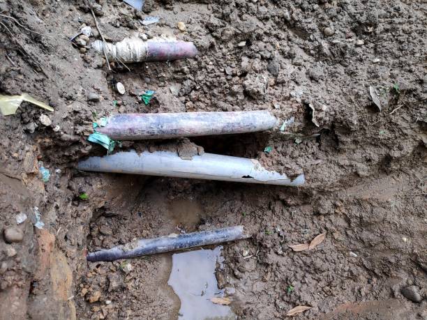 istock Broken or damage pvc pipe on the mud ground. 1308413553