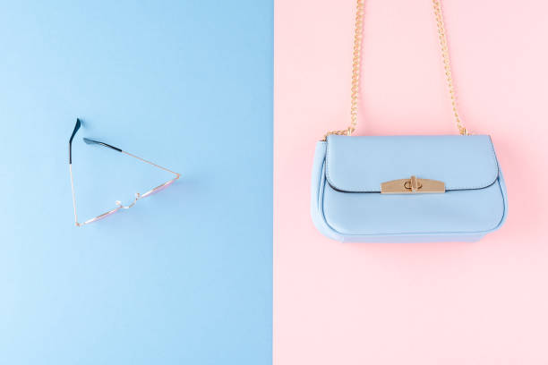 istock Women's purse and sunglasses. Flat lay 1308416214