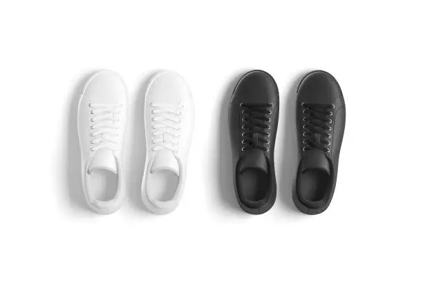 Photo of Blank black and white leather sneakers with lace mockup, isolated