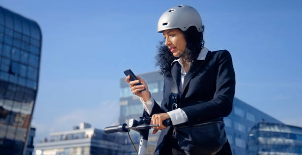 istock Businesswoman using smart phone in city 1308418166