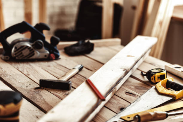 istock Hand saw on a wooden table in carpentry workshop 1308419034