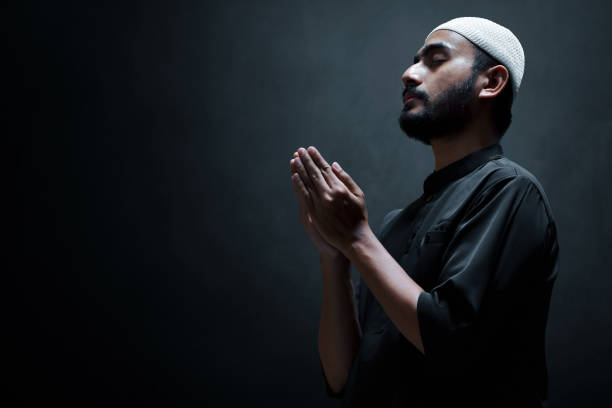 istock Religious asian muslim man praying 1308419079