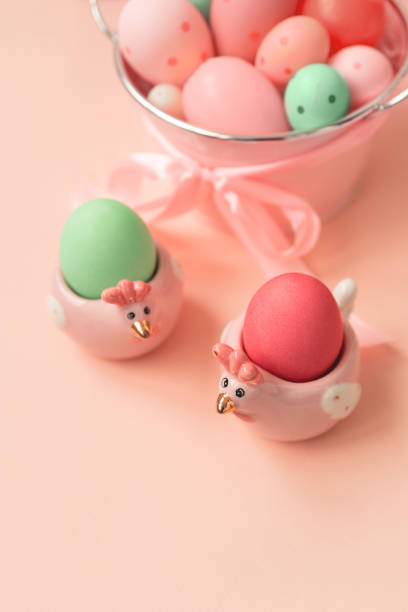 istock Easter eggs and ceramic hen on pink wooden table. Easter celebration concept. Soft focus. Copy space 1308420987