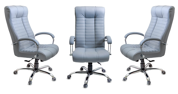 Set of large empty office chairs from gray leather, isolated on white background.