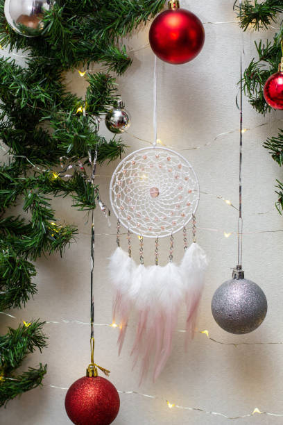 istock Handmade dream catcher with feathers threads and beads rope hanging 1308423425