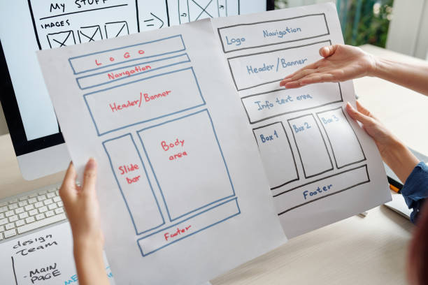 istock Designers discussing website layouts 1308423694
